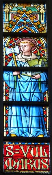 Sint Vulmar met zijn bijl en de door hem gestichte kloosterkerk.