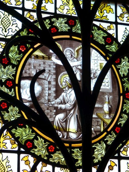 Wenceslaus bakt hosties; de kan met wijn staat achter hem al klaar