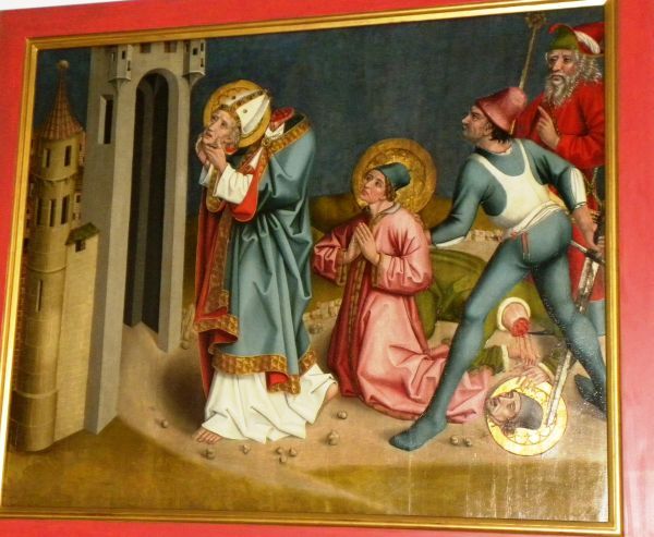 Dionysius neemt zijn hoofd in zijn handen en wandelt ermee van de plaats van zijn terechtstelling (Montmartre) naar de plaats waar hij begraven zal worden (Saint-Denis).