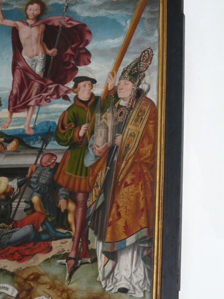 Kunibert (met kerkmodel) bij de opstanding.